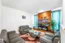 Living area featuring wood finished floors and wooden walls