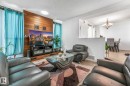 Living area featuring wood finished floors, a textured ceiling, and hanging lights