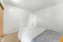 Bedroom featuring a textured ceiling and carpet flooring