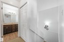Bathroom with vanity, a textured ceiling, and light wood-type flooring