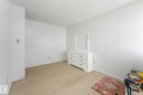 Unfurnished bedroom with carpet and a textured ceiling