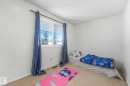 Unfurnished bedroom with carpet flooring and a textured ceiling