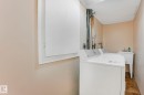 Laundry room with stone finish flooring and washing machine and dryer