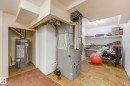 Utility room with water heater and heating unit