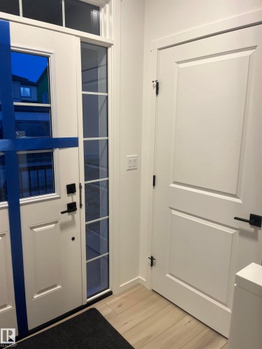 Entryway with wood finished floors