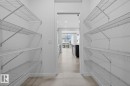 Walk in closet with light tile patterned floors