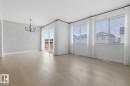 Unfurnished dining area with light wood-type flooring and a chandelier