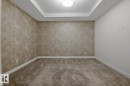 Unfurnished room with carpet flooring and baseboards