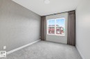 Spare room with carpet flooring and wallpapered walls