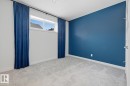Spare room featuring light carpet and baseboards
