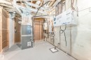 Utilities featuring tankless water heater and heating unit