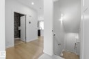 Staircase featuring recessed lighting and wood finished floors