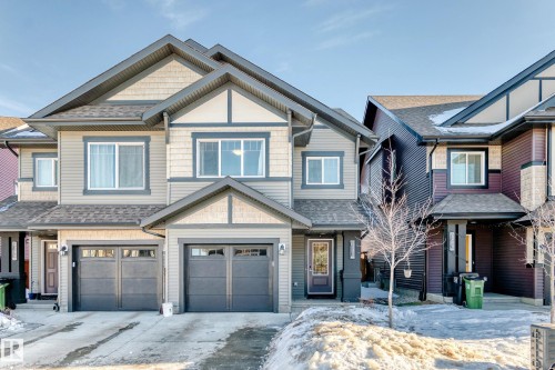 Craftsman house with an attached garage, concrete driveway, a shingled roof, and covered porch
