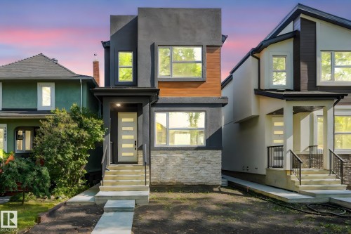 Contemporary house featuring stucco siding and stone siding