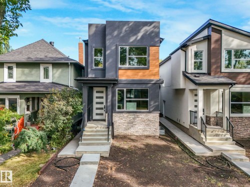 Contemporary house featuring stucco siding and stone siding