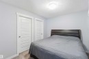 This room features light-colored walls, white paneled doors, and a neutral-toned carpet
