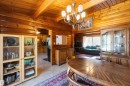 Dining area with wood-finish walls and ceiling beams