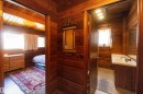 Wood-paneled hallway providing access to two distinct areas