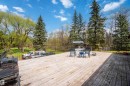 Expansive wood deck with a perimeter railing