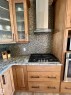 Integrated gas cooktop with stainless steel range hood