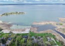Waterfront property with extensive shoreline, a private dock, and a boat launch