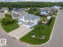 Corner lot residence featuring a two-story design with multiple balconies
