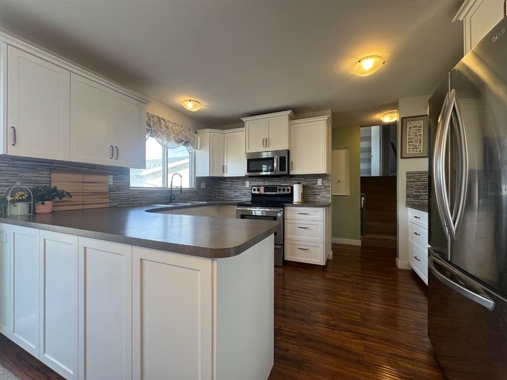 









5718


Marler

Drive,
Camrose,




AB
T4V 2S8

