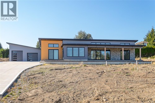Welcome home to 10928 Grandview! West Coast Modern architectural gem with ocean and mountain views.