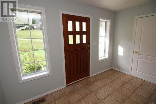 Spacious foyer with tiled flooring