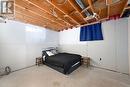 Bedroom featuring concrete floors