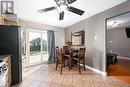 Dining space with ceiling fan and light hardwood / wood-style floors