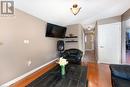 Living room featuring hardwood / wood-style floors and vaulted ceiling