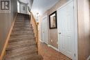 Staircase with tile patterned floors