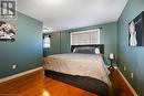 Bedroom featuring wood-type flooring and a textured ceiling