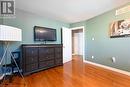 Bedroom with wood-type flooring and a textured ceiling