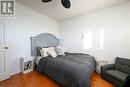 Bedroom with hardwood / wood-style flooring and ceiling fan