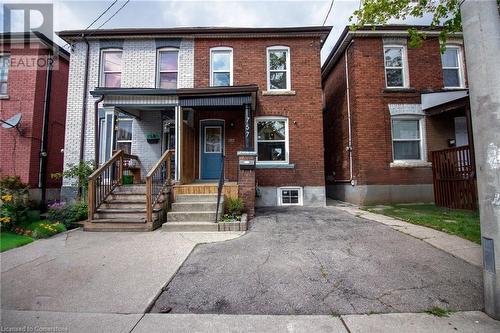 Multi unit property with brick siding and a porch