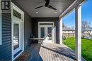 Wooden terrace with french doors and a ceiling fan
