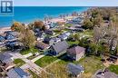 Aerial perspective of suburban area with a nearby body of water