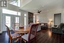 Dining space with dark wood-type flooring, recessed lighting, and a ceiling fan