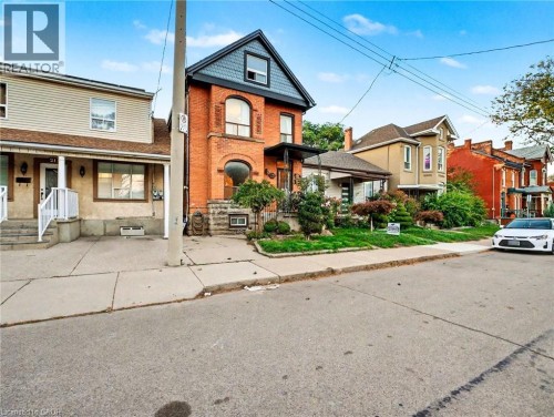 Victorian home with brick siding