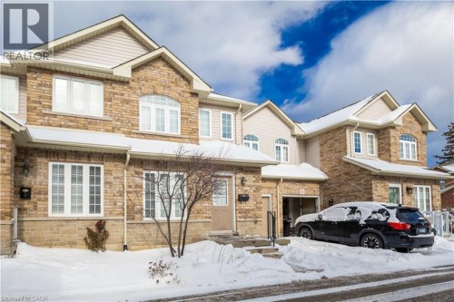 View of front facade featuring stone siding