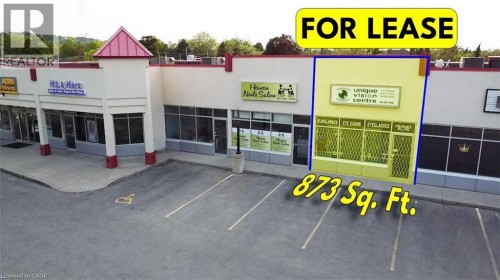 View of commercial location with uncovered parking