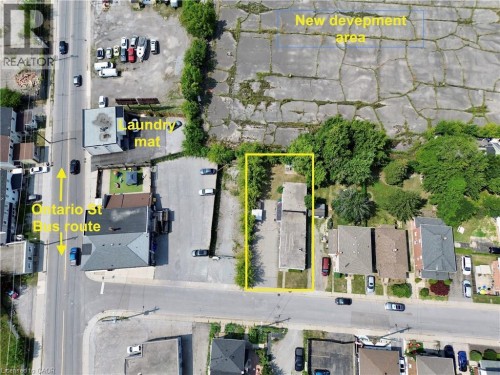 Aerial view of property and surrounding area with property parcel outlined