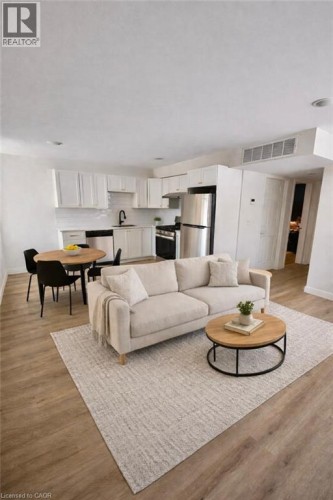 Open concept living/dining. Photos prior to current tenants.