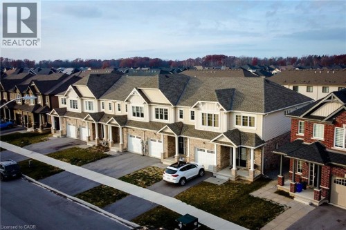 Modern townhome featuring stone and siding exterior construction
