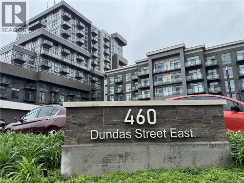 Modern residential building with a stone-clad address monument