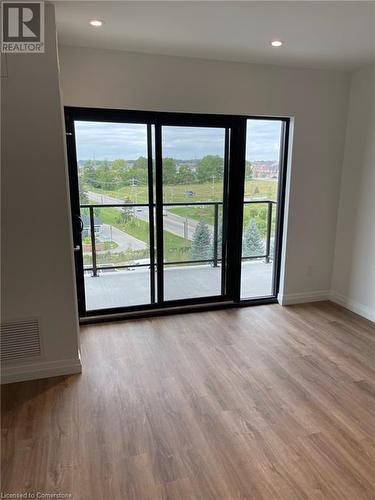 Spare room with hardwood / wood-style floors