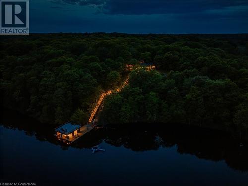 Bird's Nest Cottage: Expansive Timber Ceilings and Unmatched Lakefront Views on a Private Lake. This stunning Muskoka bungalow is the ultimate retreat for those seeking privacy and natural beauty on a