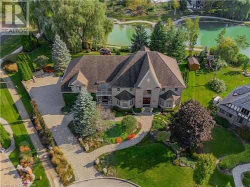 Lakefront Luxury: Masterpiece Backing Onto Emerald Lake in River Oak Estates